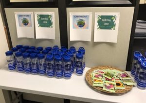 NCP's Employee Engagement Team distributed water bottles and flower seeds in honor of Earth Day 2019
