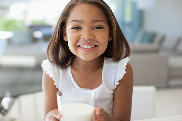 Girl drinking glass of milk